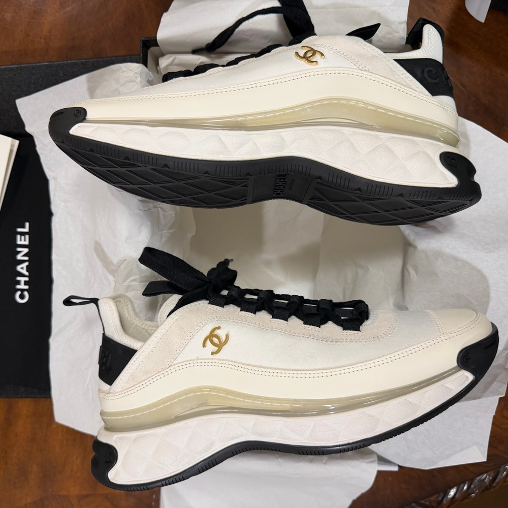 CHANEL Ivory and Black Sneakers with Gold Accents
